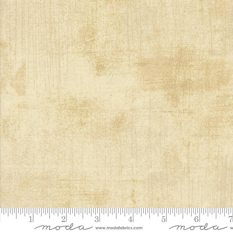 Beige fabric texture with a ruler at the bottom for scale, featuring the Moda Fabrics logo.