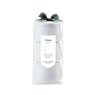 Gift set with a white box and green bow on a white background